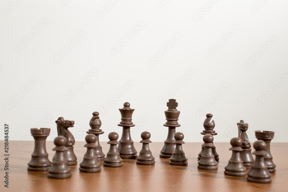 Complete and detailed set of chess on a wood table Complete and detailed set of chess on a wood table