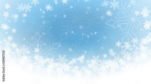 Light blue abstract winter background, white snowflakes fall off