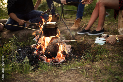 bright red bonfire at campsite in the evening photo