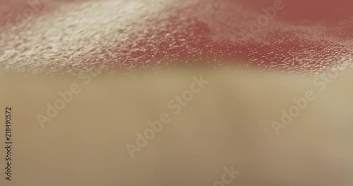 Slow motion handheld closeup of car paint wiping with alcohol photo