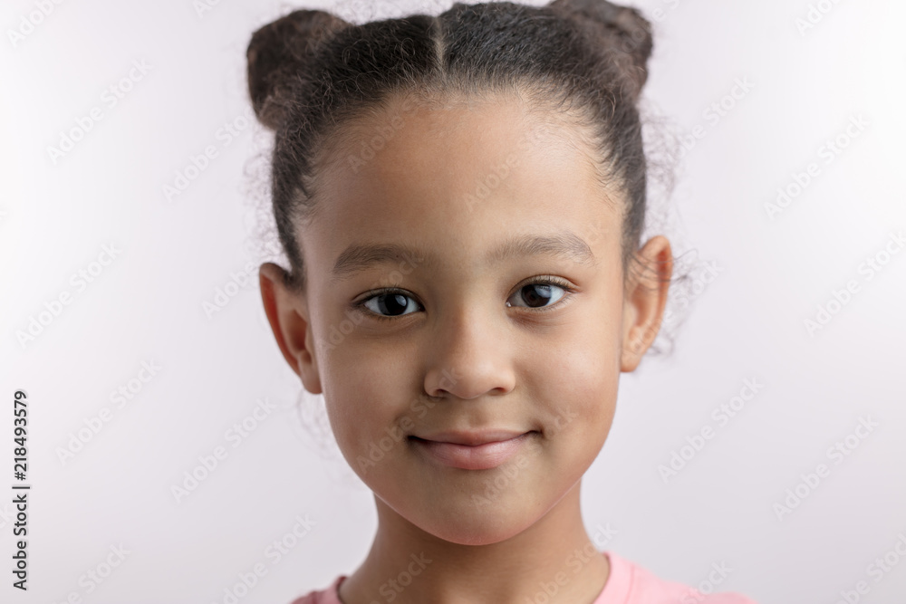 beautiful mulatto girl with wavy black hair in good mood. close up  portrait. beauty concept. healthy child with balck eyes Stock Photo | Adobe  Stock