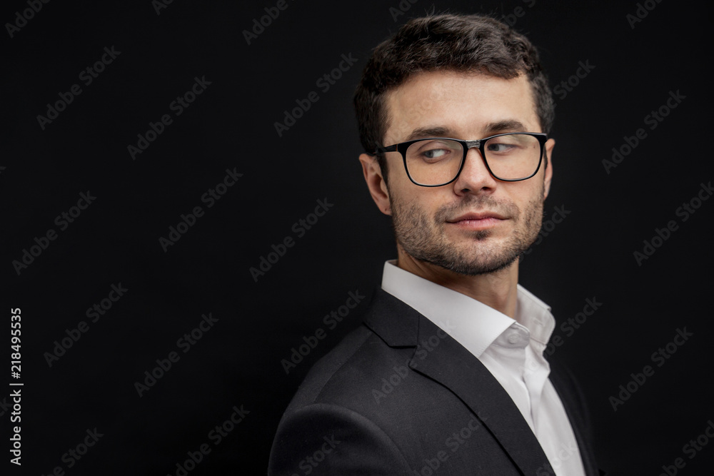 close up side view portrait of young attractive businessman looking back. look aside. guy is eavedropping his colleague's conversation. copy space. curiousity concept close up side view portrait of young attractive businessman looking back. look aside. guy is eavedropping his colleague's conversation. copy space. curiousity concept
