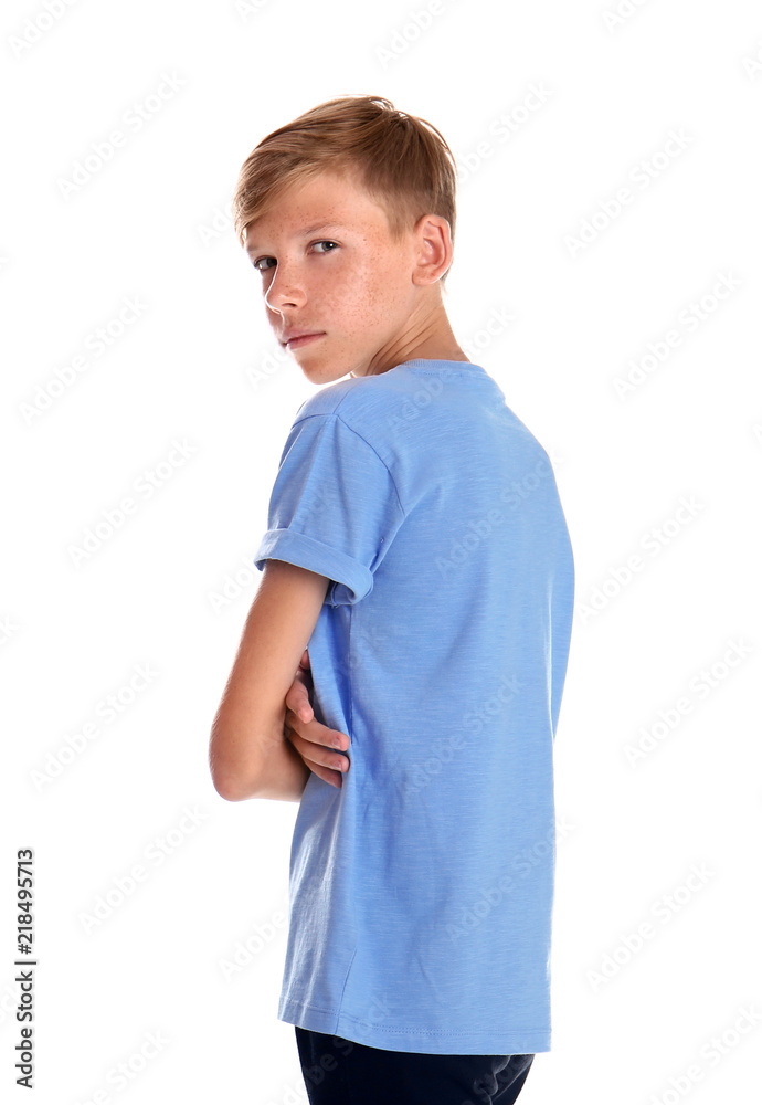 Portrait of young boy standing against white background Portrait of young boy standing against white background