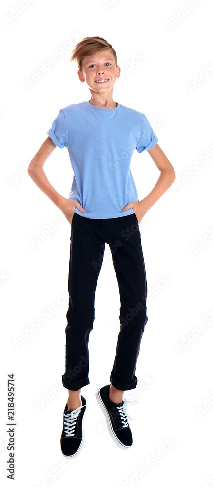 Portrait of young boy jumping on white background Portrait of young boy jumping on white background