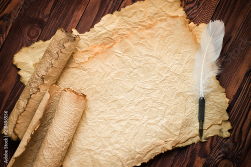 paper scroll with feather p...