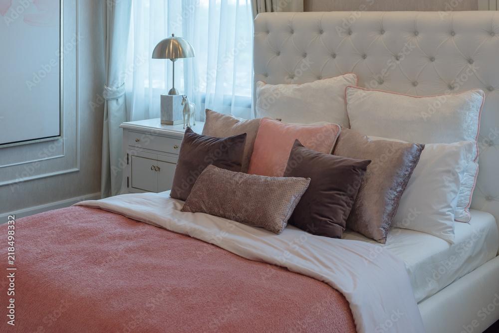 luxury suite bedroom with set of pink pillows