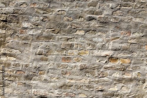 Background or texture of old vintage dirty grunge brick wall with peeling plaster and concrete
