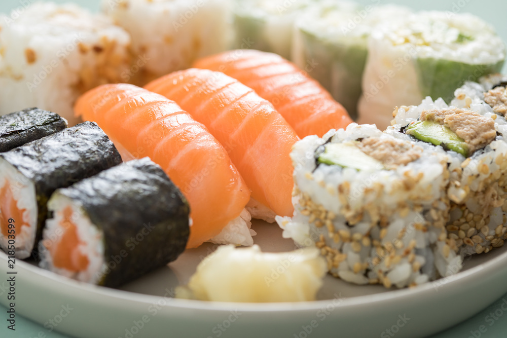 Salmon and tuna sushi mix plate with Nigiri, Maki and inside out California rolls Salmon and tuna sushi mix plate with Nigiri, Maki and inside out California rolls