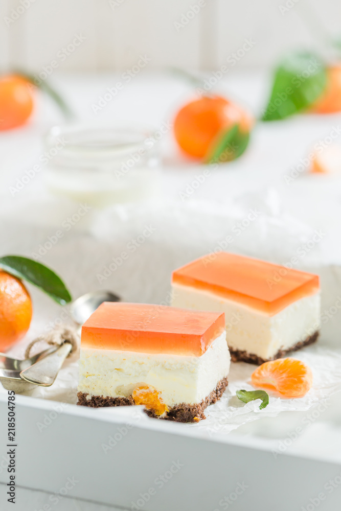 Closeup of sweet cheesecake made of jelly and fresh mandarin Closeup of sweet cheesecake made of jelly and fresh mandarin