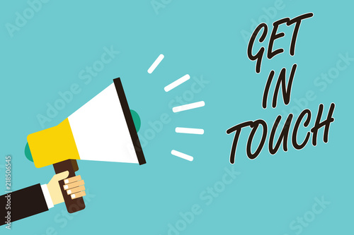 Text sign showing Get In Touch. Conceptual photo Stay in contact Constant Communication Interaction Bonding Man holding megaphone loudspeaker blue background message speaking loud.
