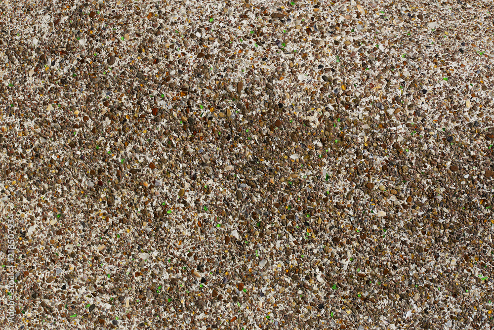 Background of small pebbles, colored glass fragments and pieces of sea shells. Background of small pebbles, colored glass fragments and pieces of sea shells.