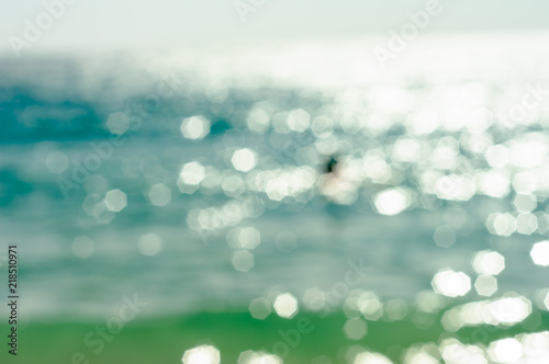 Abstract textures surface pattern design bright glitter geometry octagon bokeh of the clear waters reflect the sunshine in the daytime at Koh Samet in Thailand, to nature background concept.