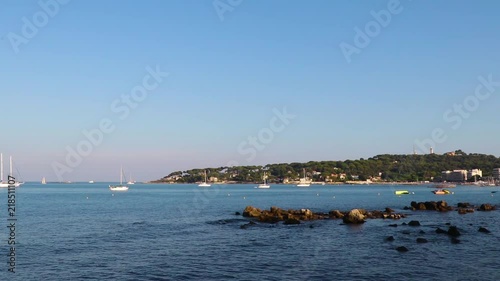 Cap d'Antibes in southern France with sailboats in front. French Riviera, August 2018. Seen from above Plage du Ponteil.