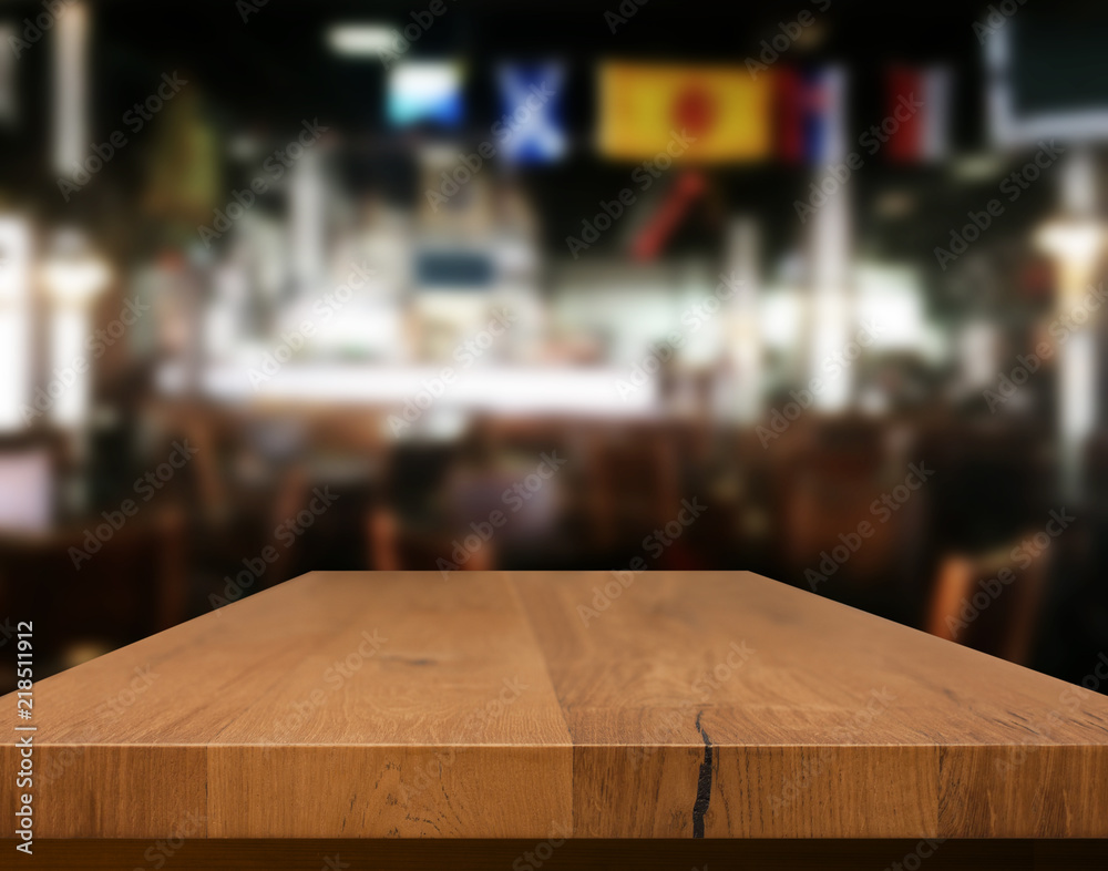 Wood table with blured background cafe , for your photo montage or product display. Space for placing items on the table. Wood table with blured background cafe , for your photo montage or product display. Space for placing items on the table.