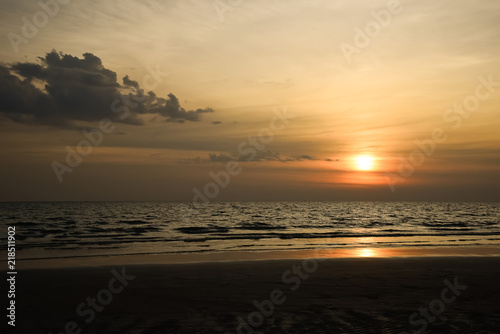 Nature in twilight period which including of sunrise over the sea and the nice beach. Summer beach with blue water and purple sky at the sunset.