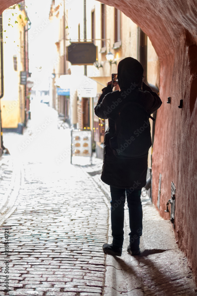 Tourist taking picture in Old Town in Stockholm