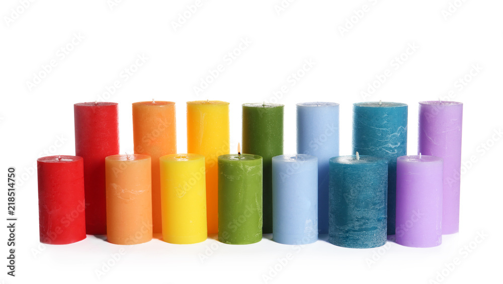Different colorful wax candles on white background Different colorful wax candles on white background