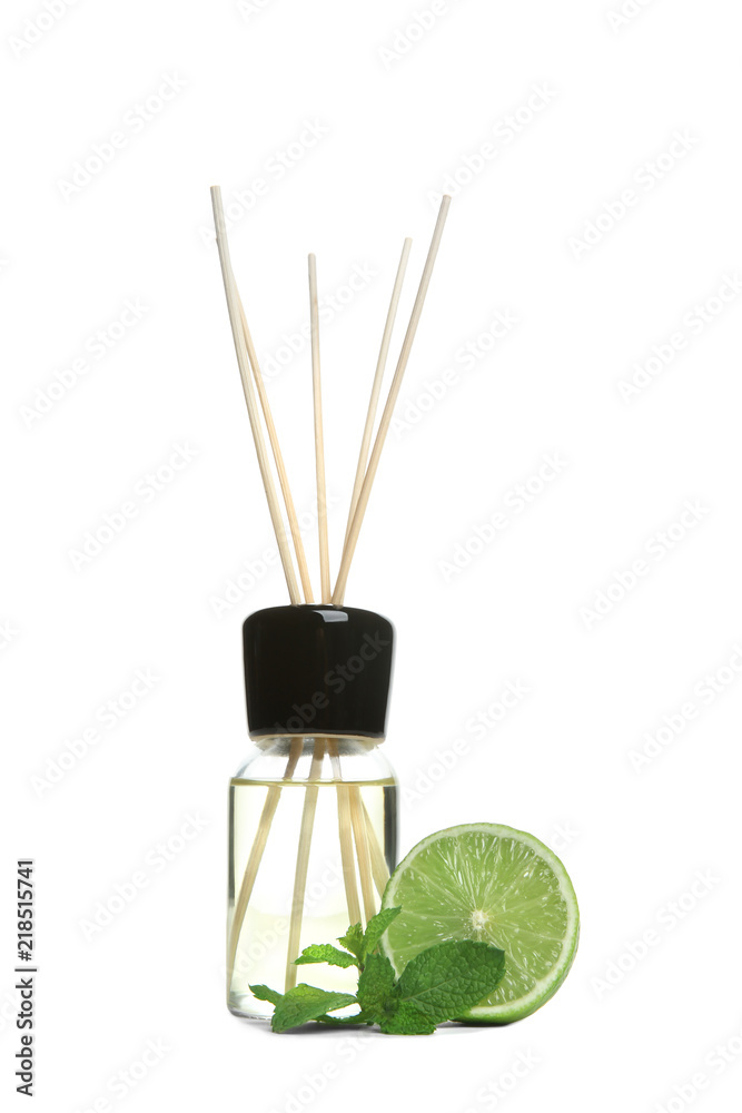 Obraz premium Aromatic reed air freshener and lime on white background