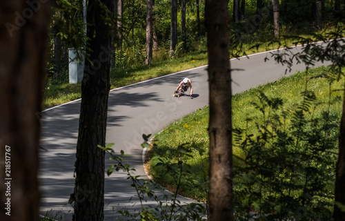 Longboard downhill rider going fast photo