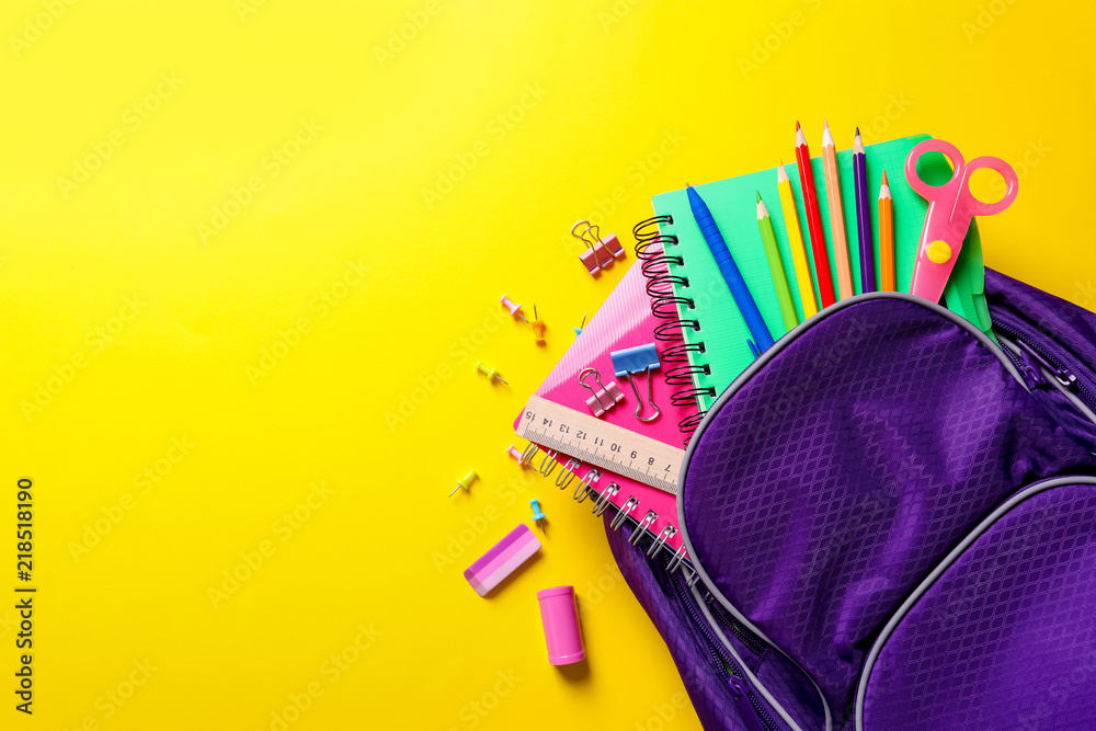 Flat lay composition with backpack and school stationery on color background - obrazy, fototapety, plakaty 