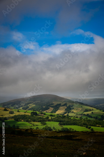 The rain clouds coming over the mountains at the Welsh Countryside in Brecon Beacons, Wales