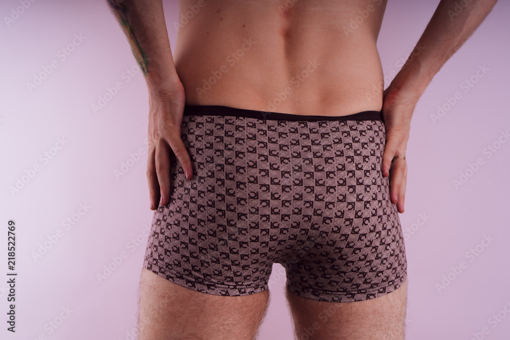 body parts: men's ass in underwear. inflated buttocks in boxer shorts.  elastic muscles after exercise and diet. concept: diseases of the anus,  constipation and male problems Stock Photo | Adobe Stock
