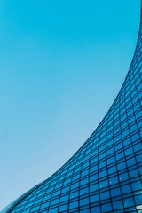 Geometric lines of the office center. Commercial modern city of the future. The concept of a successful industrial architecture