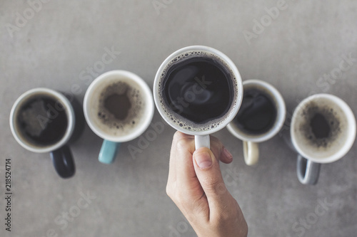 Female hand holding a cup of coffee
