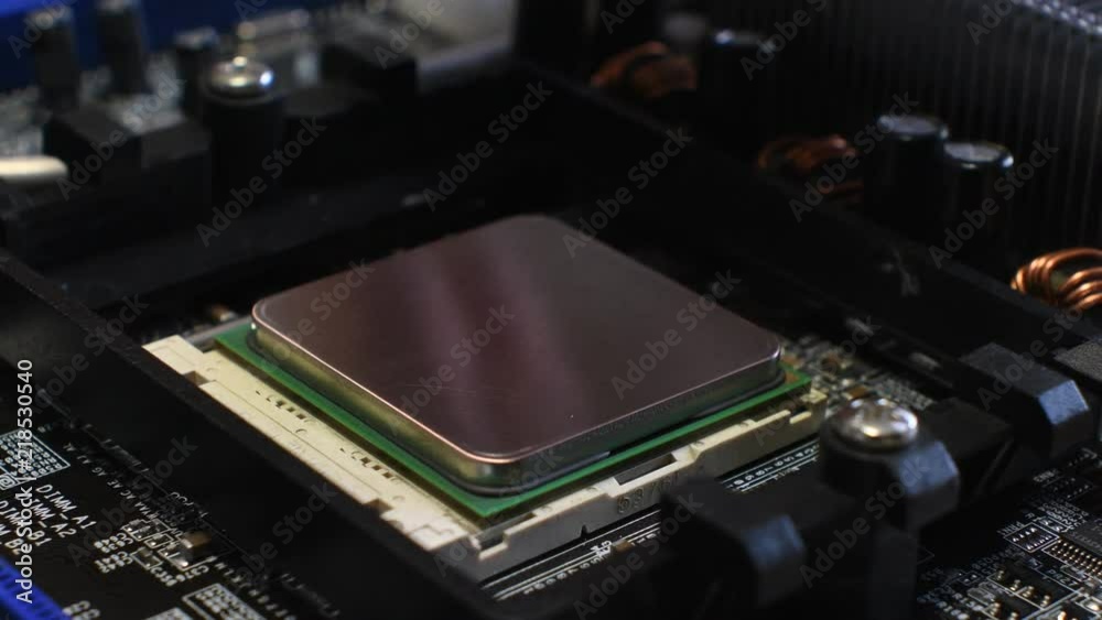 Technician remove CPU microprocessor from a motherboard socket. Technician remove CPU microprocessor from a motherboard socket.