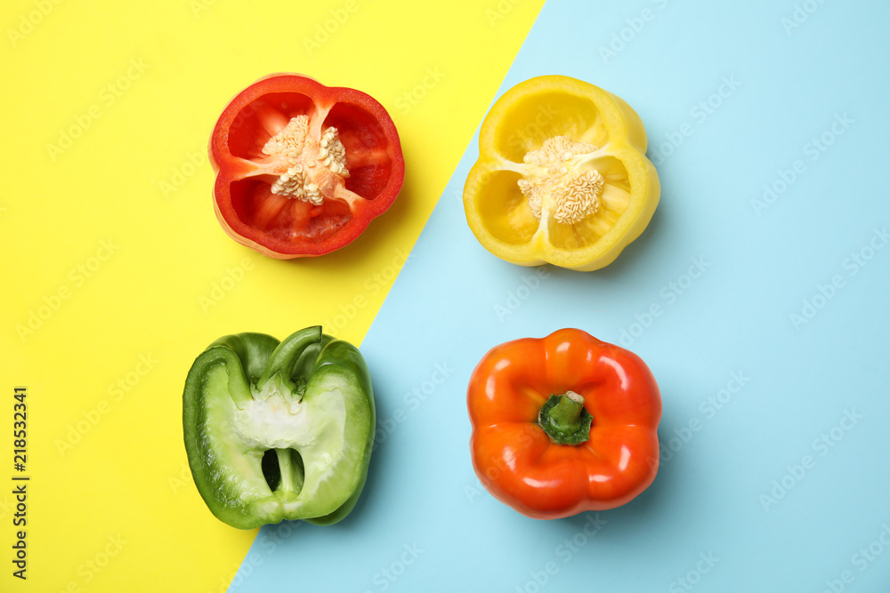 Flat lay composition with raw ripe paprika peppers on color background