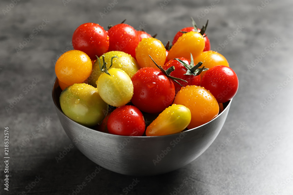 Bowl with tasty juicy tomatoes on table Bowl with tasty juicy tomatoes on table