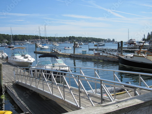 View over the water at Boothbay Harbor in Maine with boats and buoys 