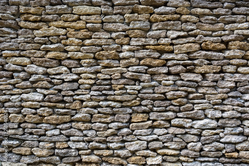 background of limestone walls, densely piled stones