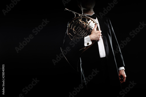 Classical musician with french horn