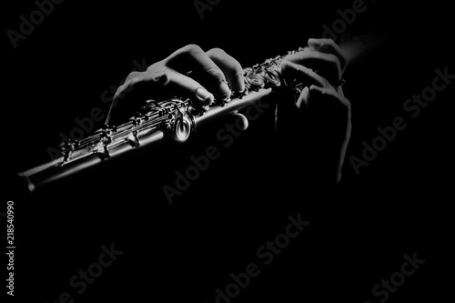 Foto Flute instrument. Flutist hands playing flute music
