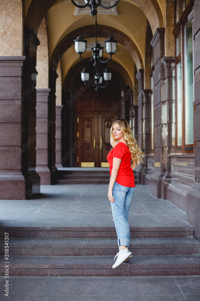 Young girl on a street walk. Street style portrait. Beautiful girl in the city. Stylish girl. Life style. Summer.