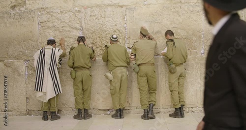 israeli idf soldiers pray in the western wall photo
