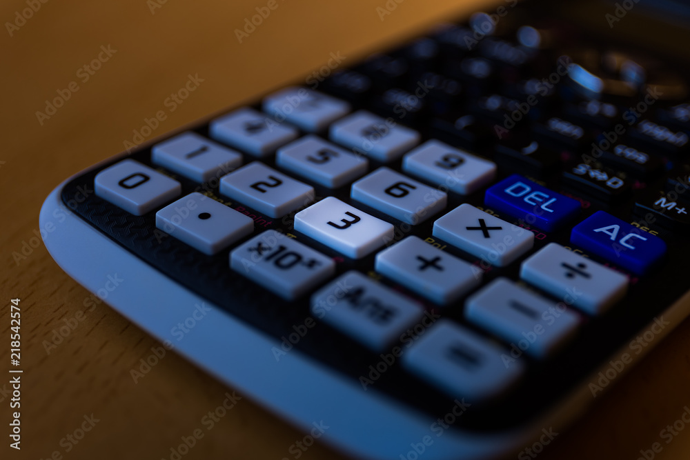 Key number three of the keyboard of a scientific calculator Key number three of the keyboard of a scientific calculator