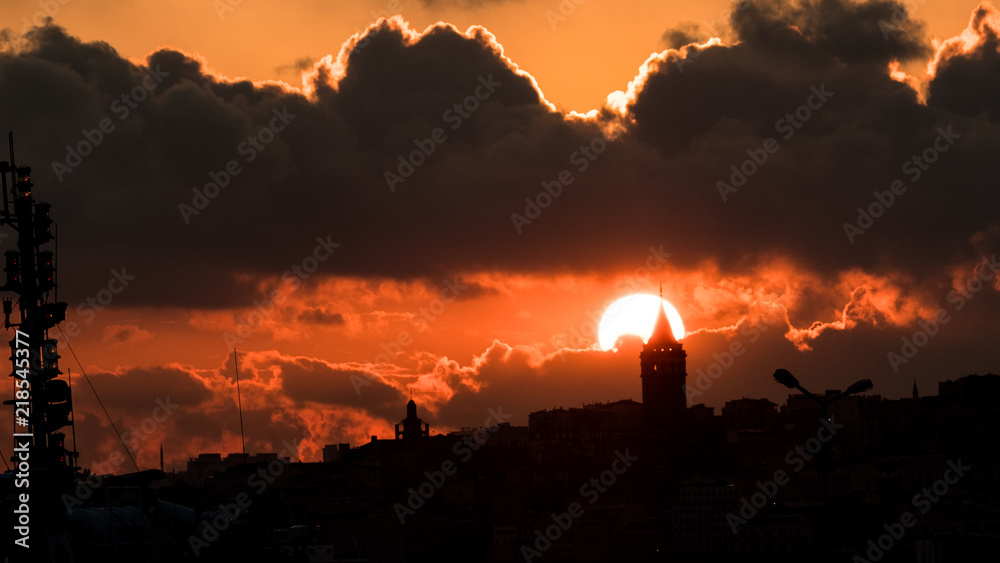 Fototapeta premium The sun sinking behind the Galata Tower