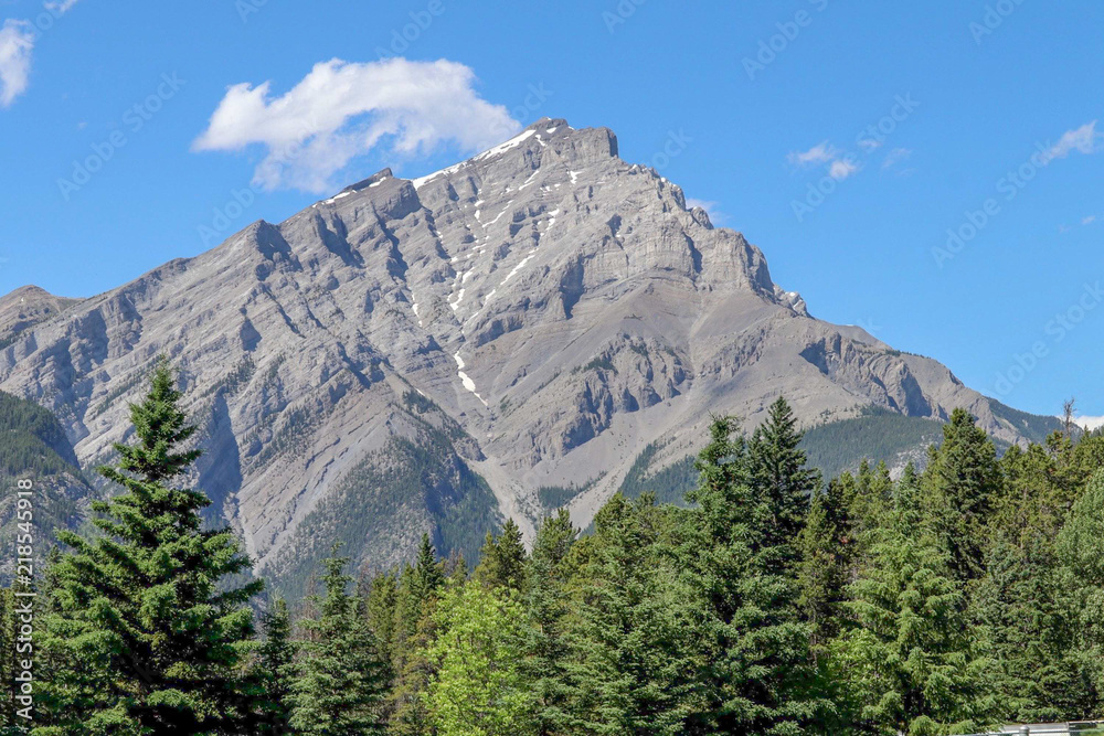 Rocky Mountains, Blue Sky with Clouds, Fur Trees in Banff, Alberta, Canada