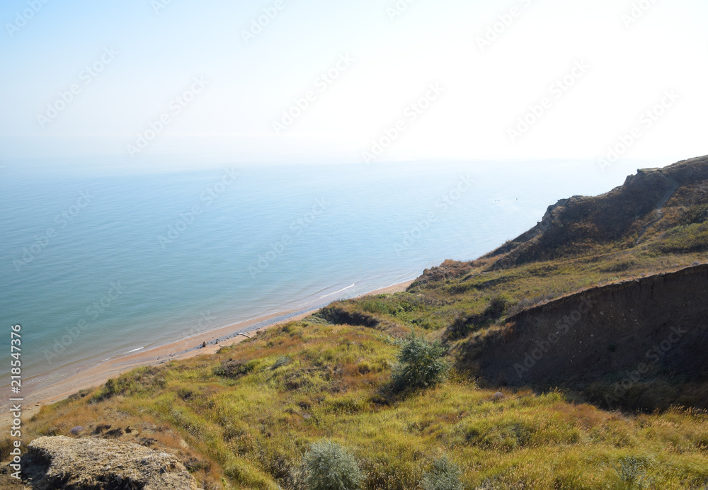 The hilly coast near the Sea of Azov. Clay rocks, a cliff on the shore.