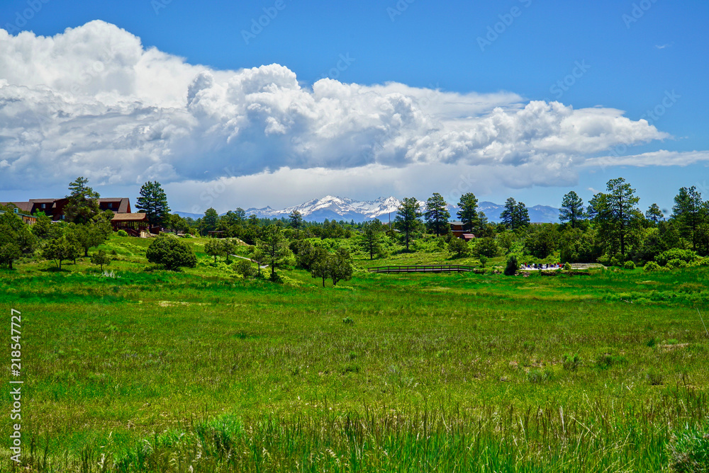 Clouds above Colorado Mountains and green pasture near Mesa Verda National Park Clouds above Colorado Mountains and green pasture near Mesa Verda National Park