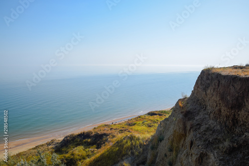 The hilly coast near the Sea of Azov. Clay rocks, a cliff on the shore.