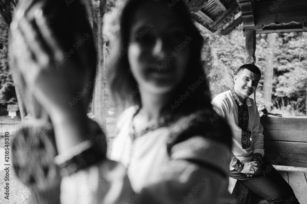 Beautiful bride and groom in the ukrainian style are standing w Beautiful bride and groom in the ukrainian style are standing w