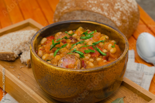 Cassoulet. Baked beans and sausages. Sausage cassoulet  photo