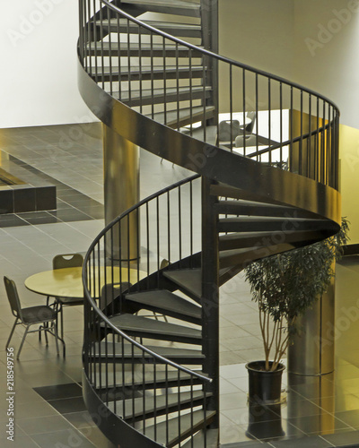 Architecture of spiral staircase and table, contemporary design