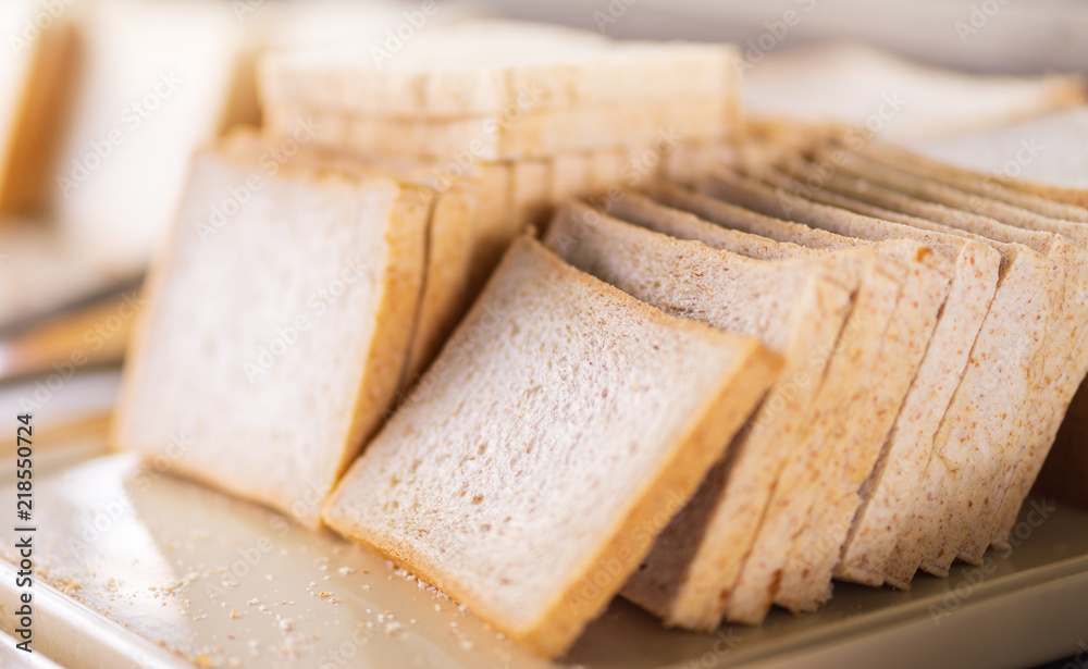 stack of sliced white bread on tray at hotel buffet line stack of sliced white bread on tray at hotel buffet line