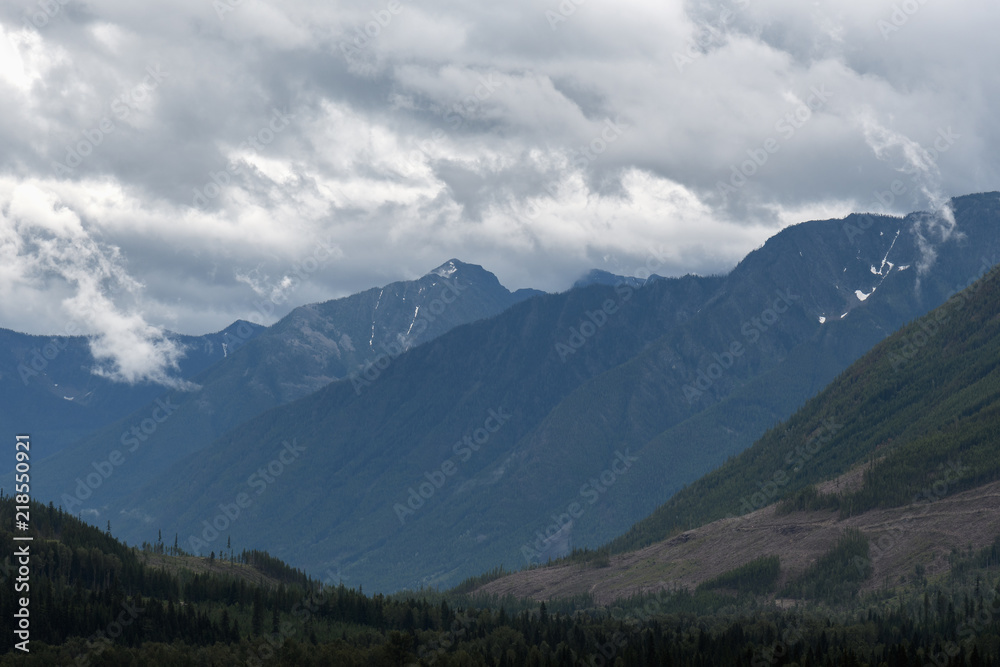 Heavy rain moves across a dramatic valley in the Canadian wilderness Heavy rain moves across a dramatic valley in the Canadian wilderness