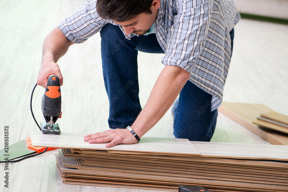 Man laying flooring at home Man laying flooring at home