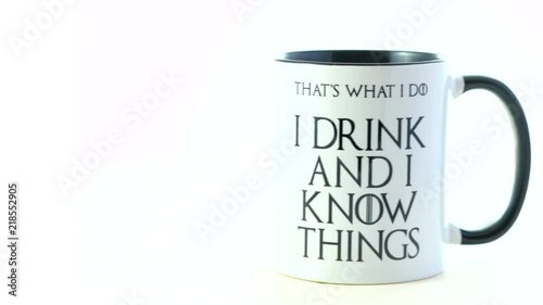 I drink and I know things quote coffee mug on white background. photo